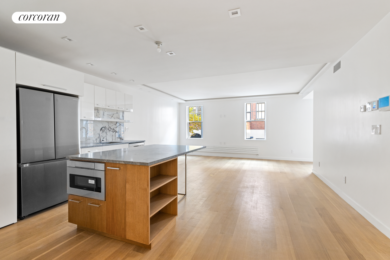 a kitchen with stainless steel appliances granite countertop a stove and a refrigerator