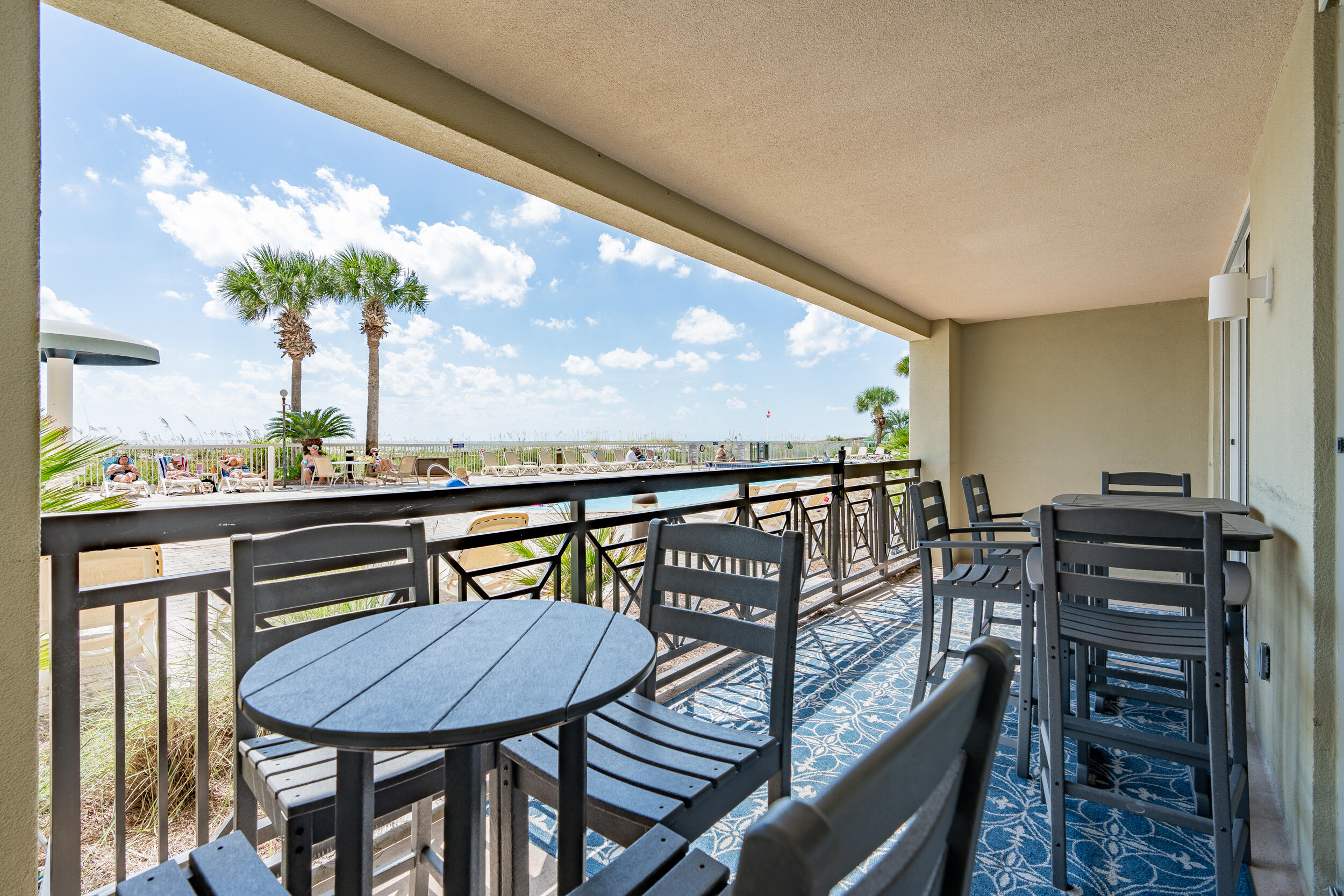 a view of a balcony with furniture