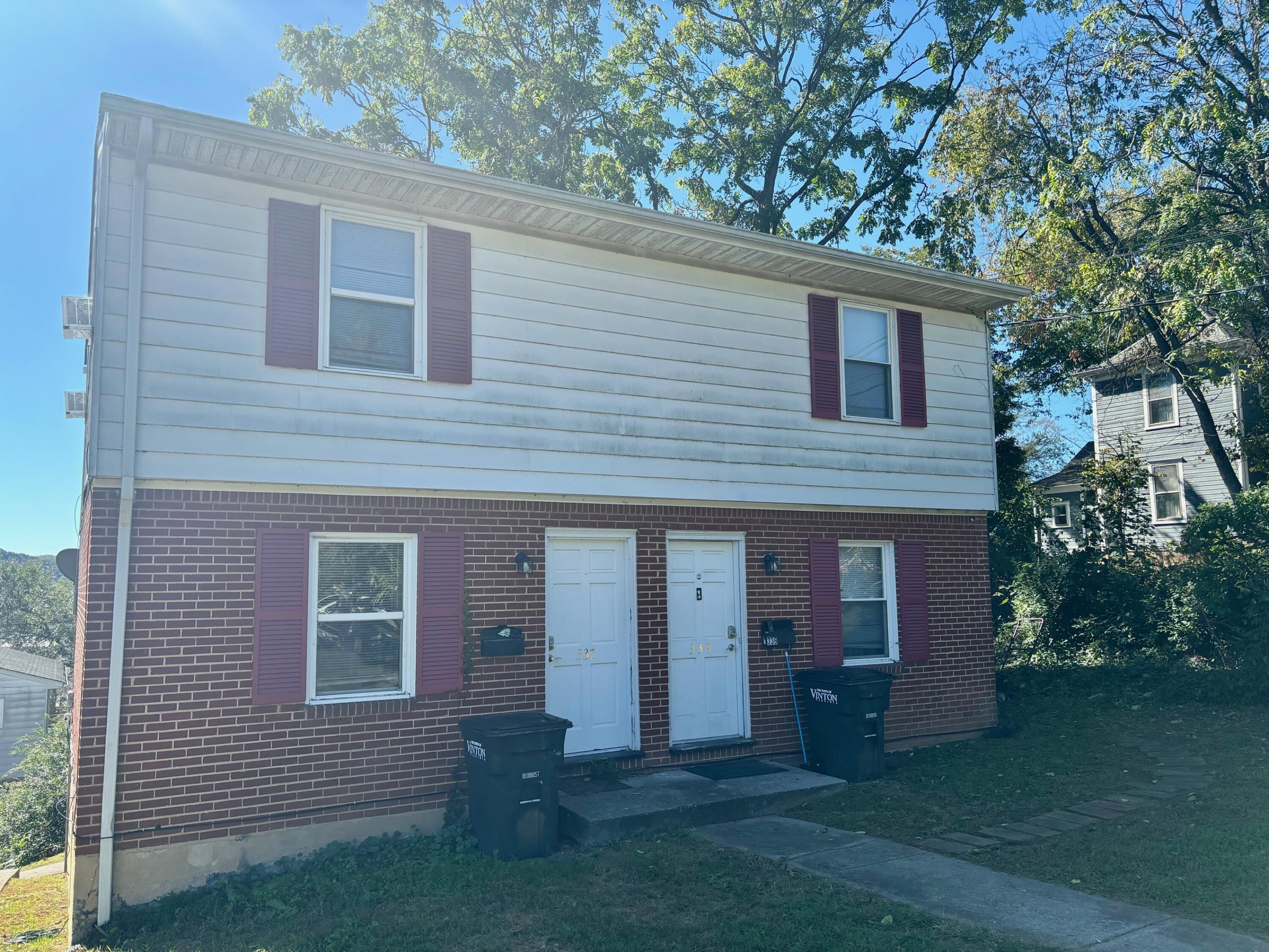 front view of a house with a yard