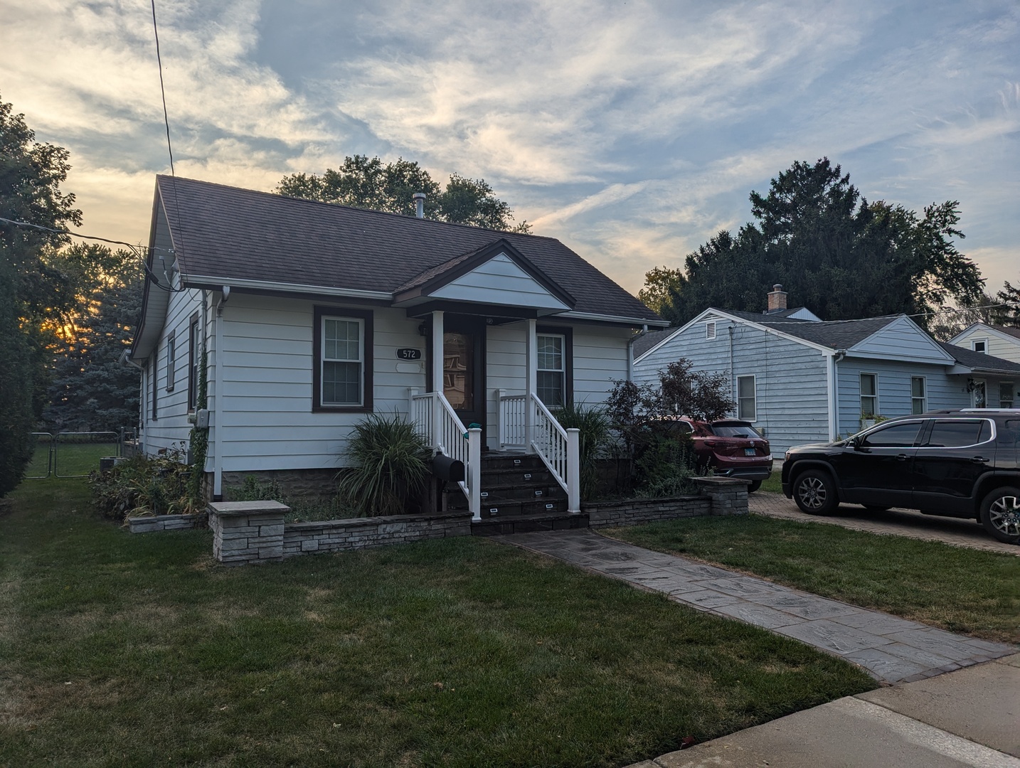 a front view of a house with garden