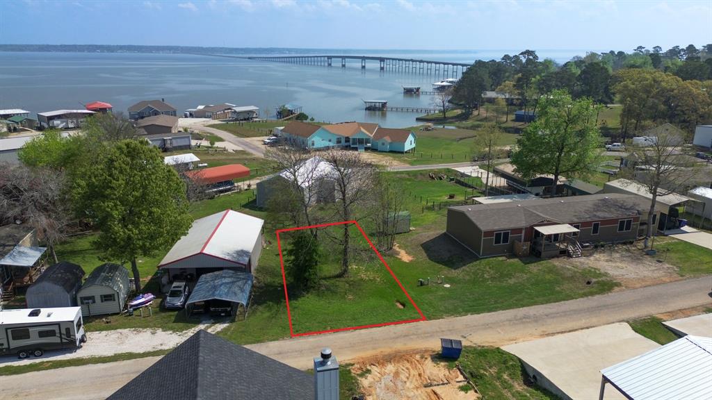 an aerial view of a house with outdoor space