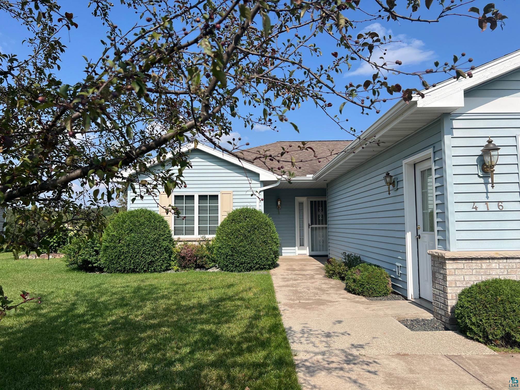 View of front of property with a front lawn