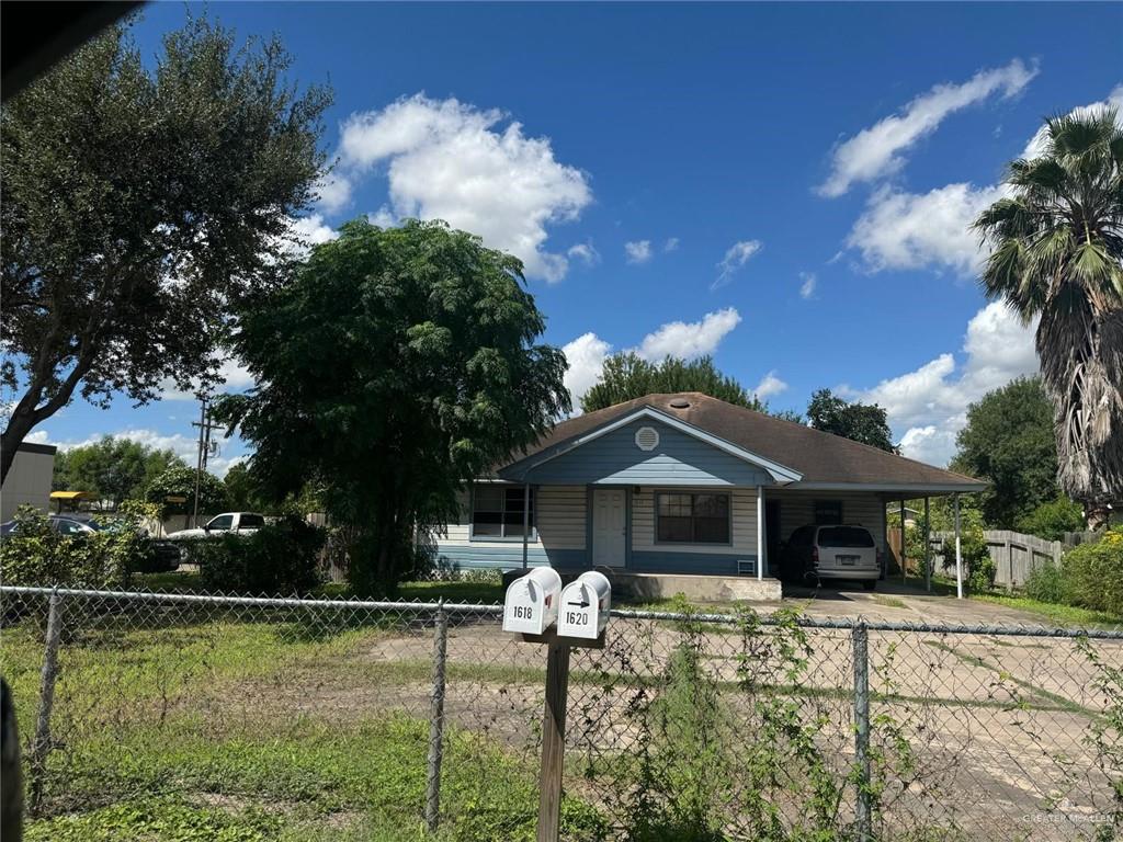 View of front of property with a carport