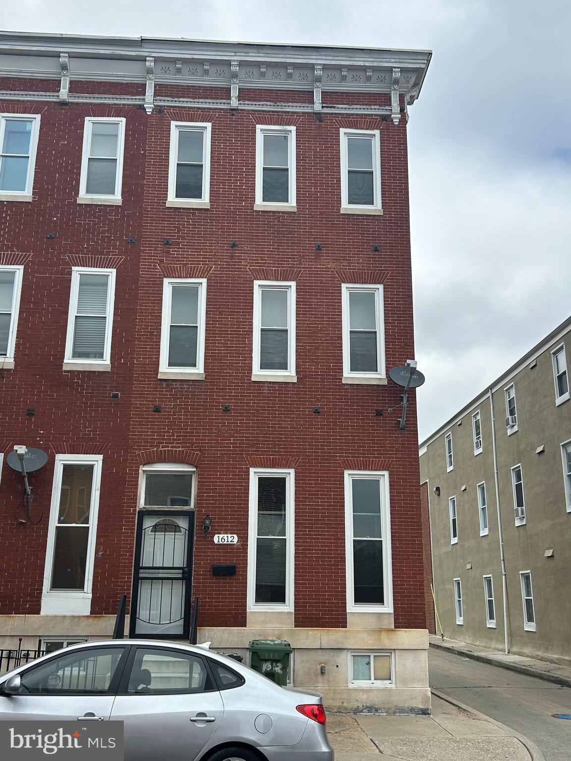 a red brick building that has lot of windows on it