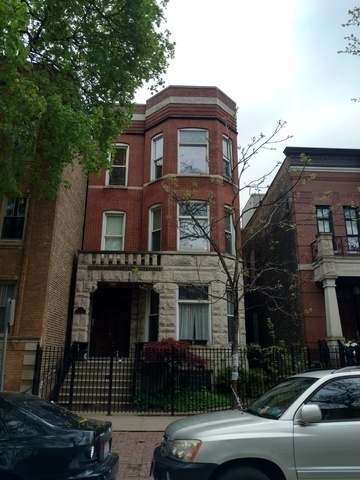 a front view of a house with parking space