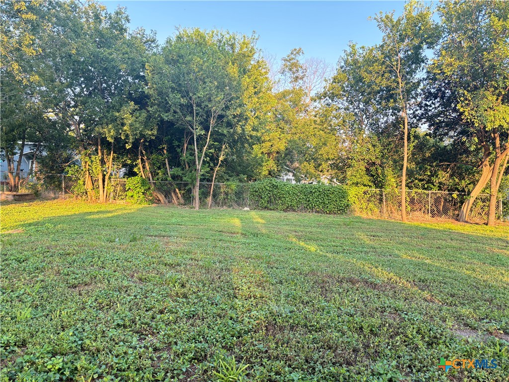 a view of outdoor space with trees all around