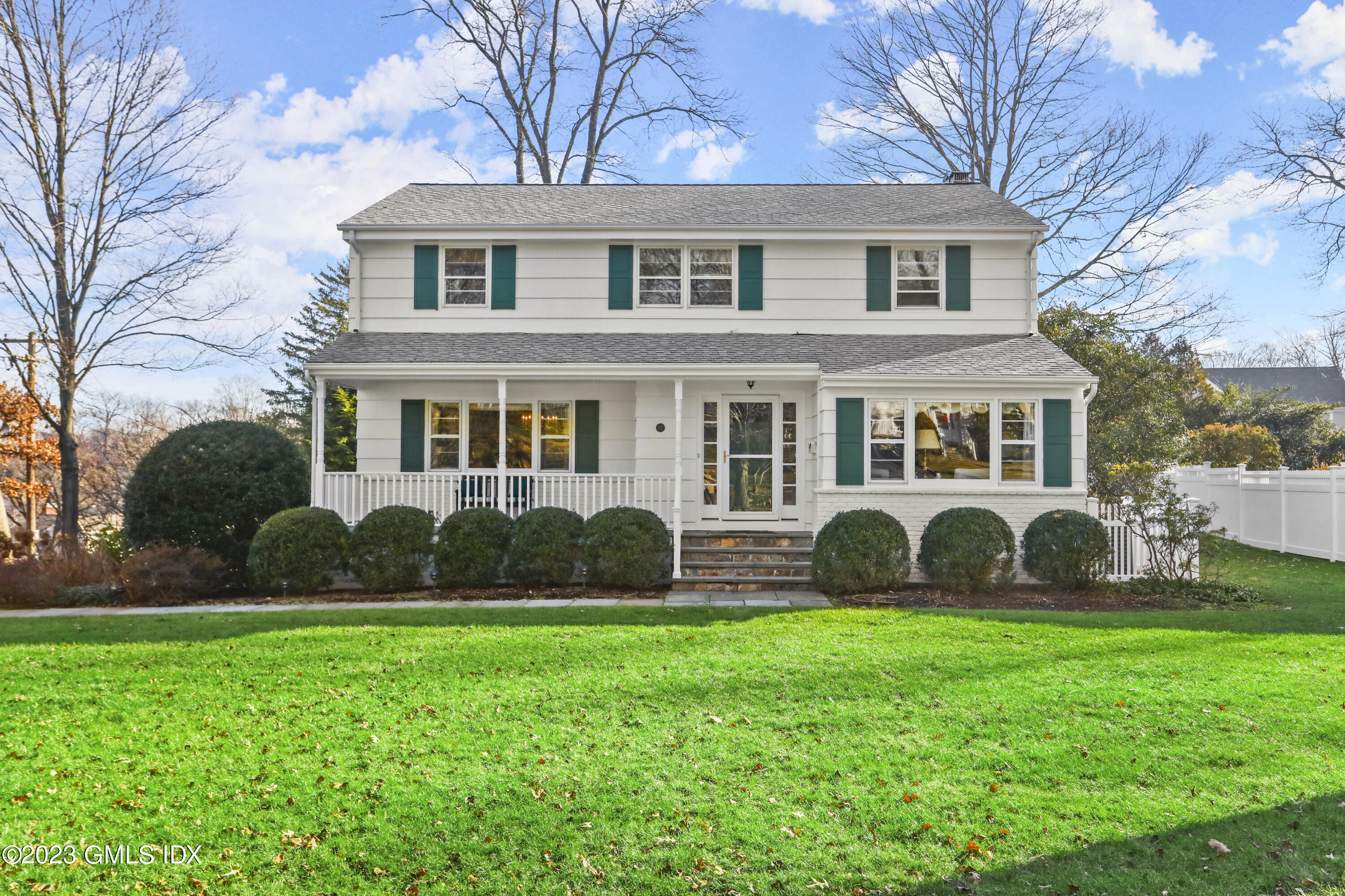 a front view of house with yard and green space