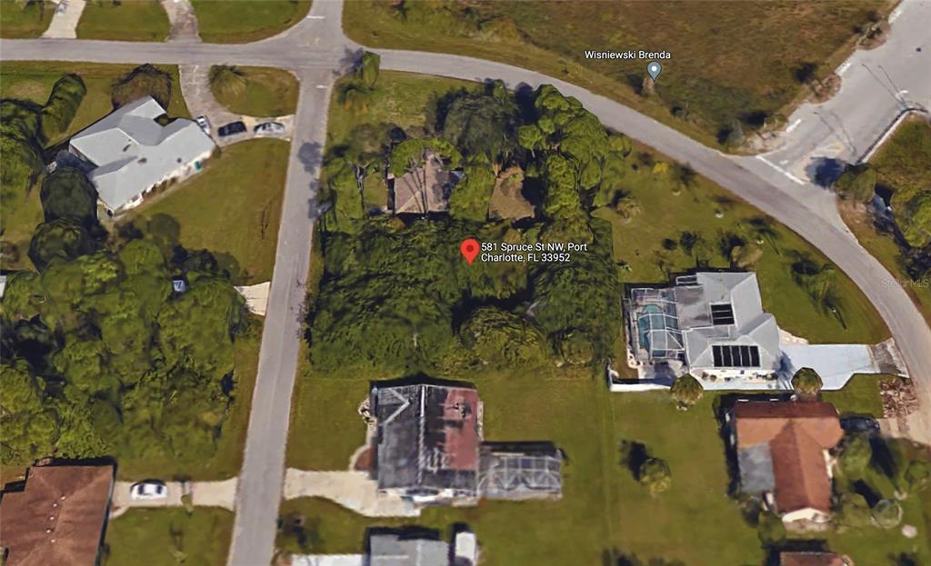 an aerial view of a house with a swimming pool