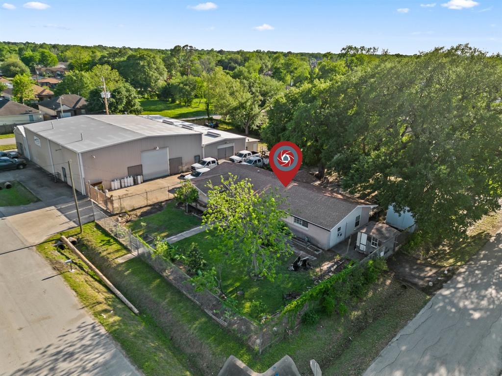 an aerial view of a house with a garden