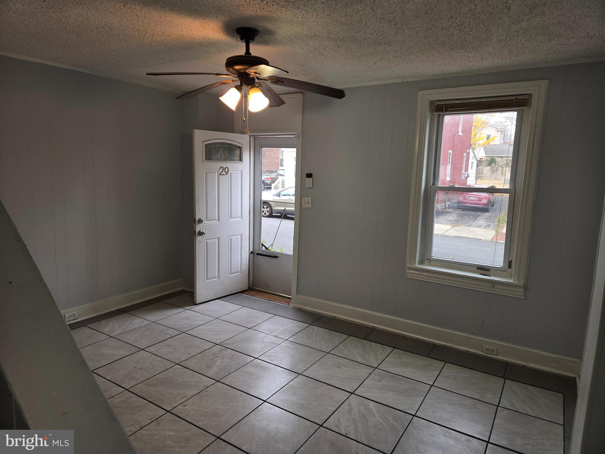 a view of an empty room with a window