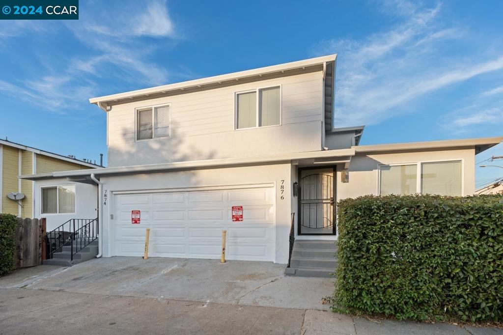 a view of a street with garage