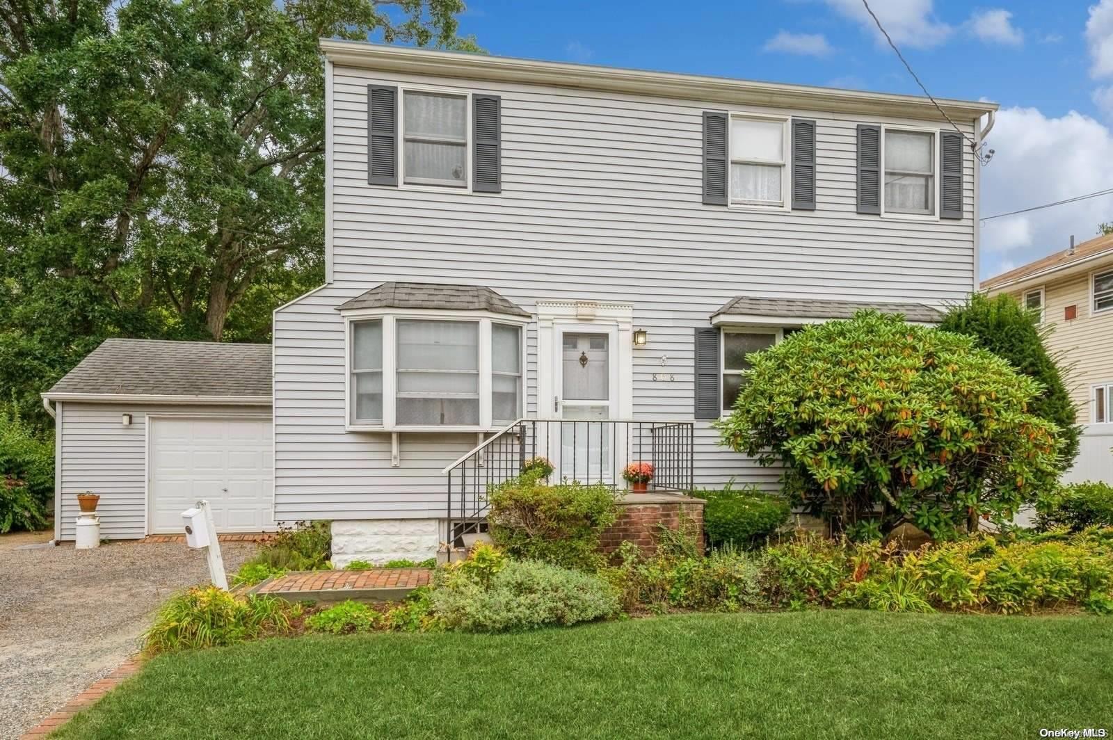 a view of a house with a yard and plants