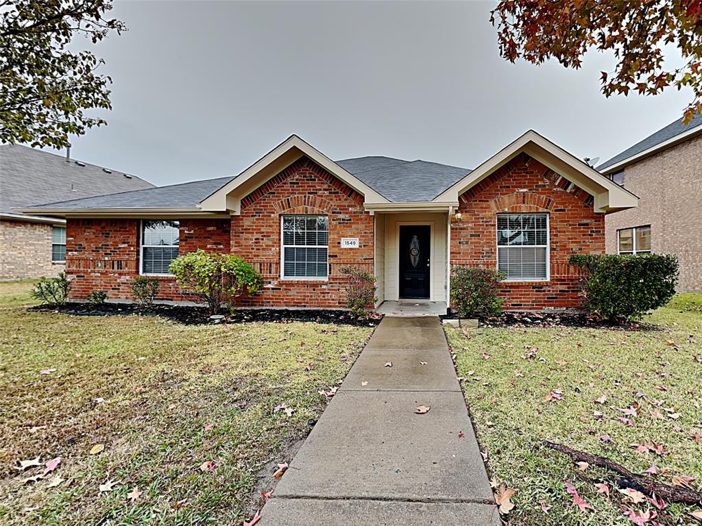 front view of a house with a small yard