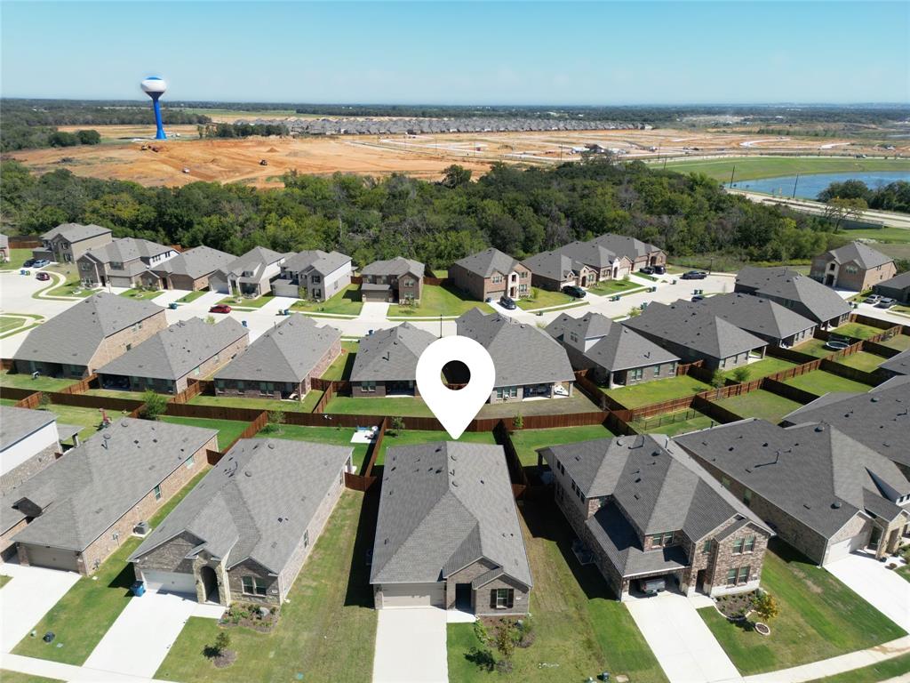 a view of multiple houses with outdoor space