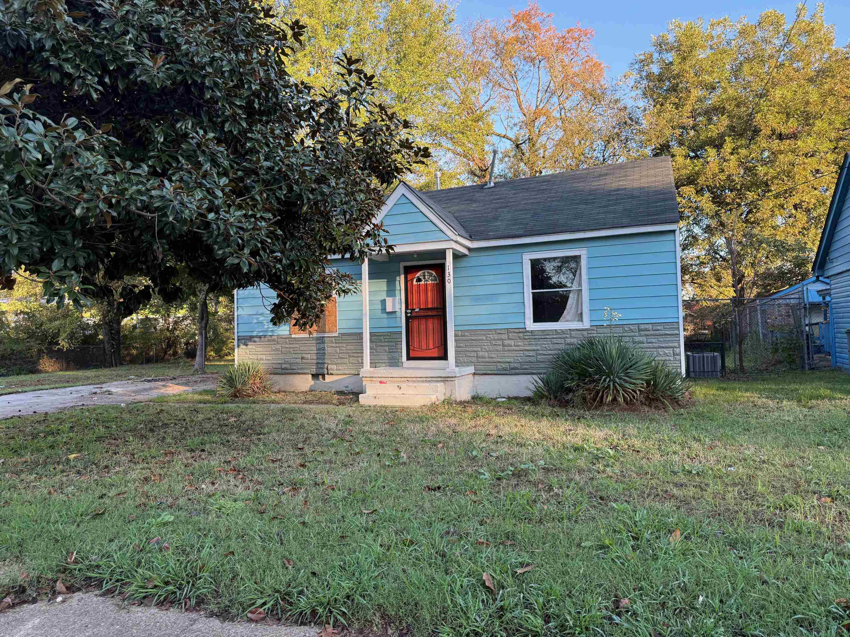 Bungalow-style home featuring a front lawn