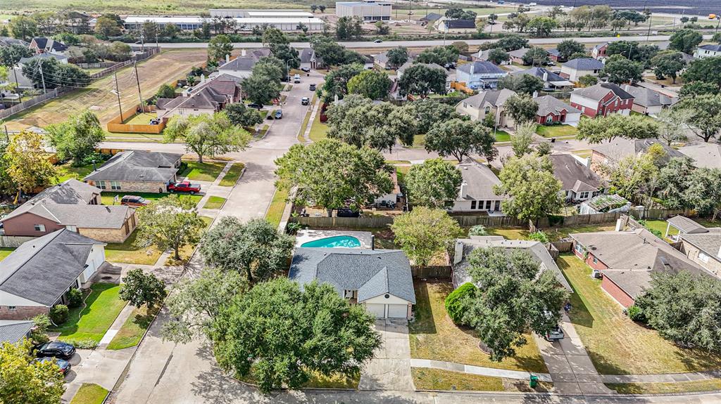 an aerial view of residential houses with outdoor space