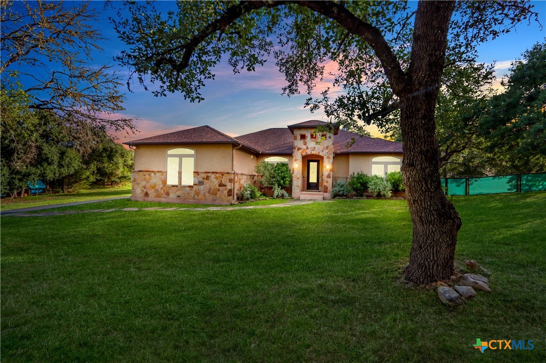 a front view of a house with garden