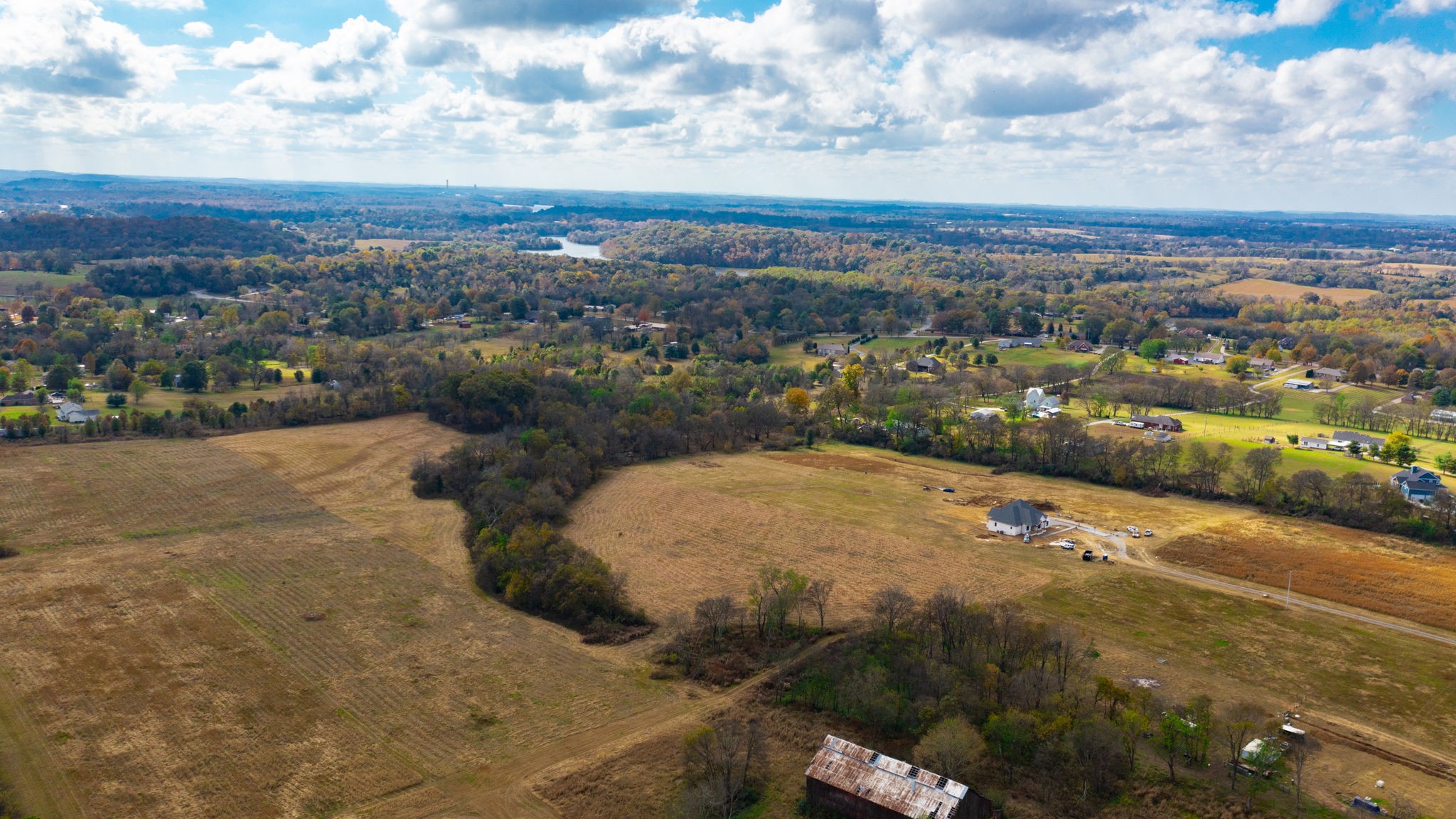 an aerial view of a houses with city view