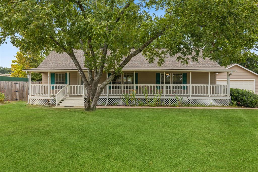 a view of a house with a backyard