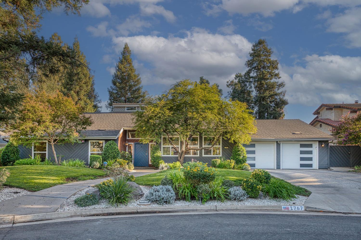 front view of a house with a garden