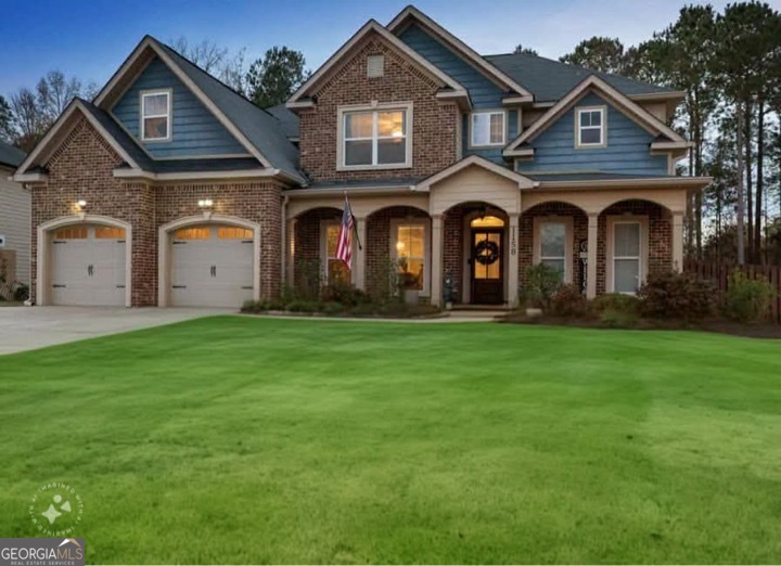 a front view of a house with garden