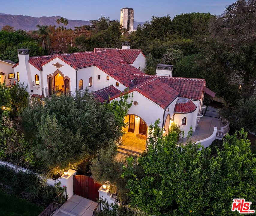 an aerial view of a house with a garden