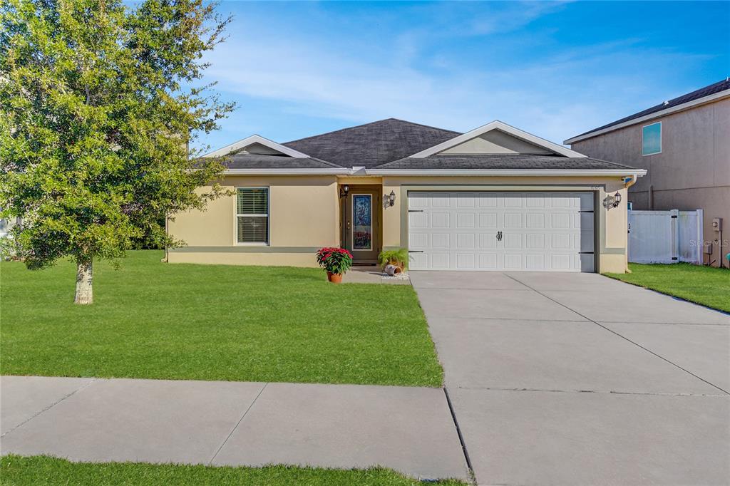 a view of a front of a house with a yard