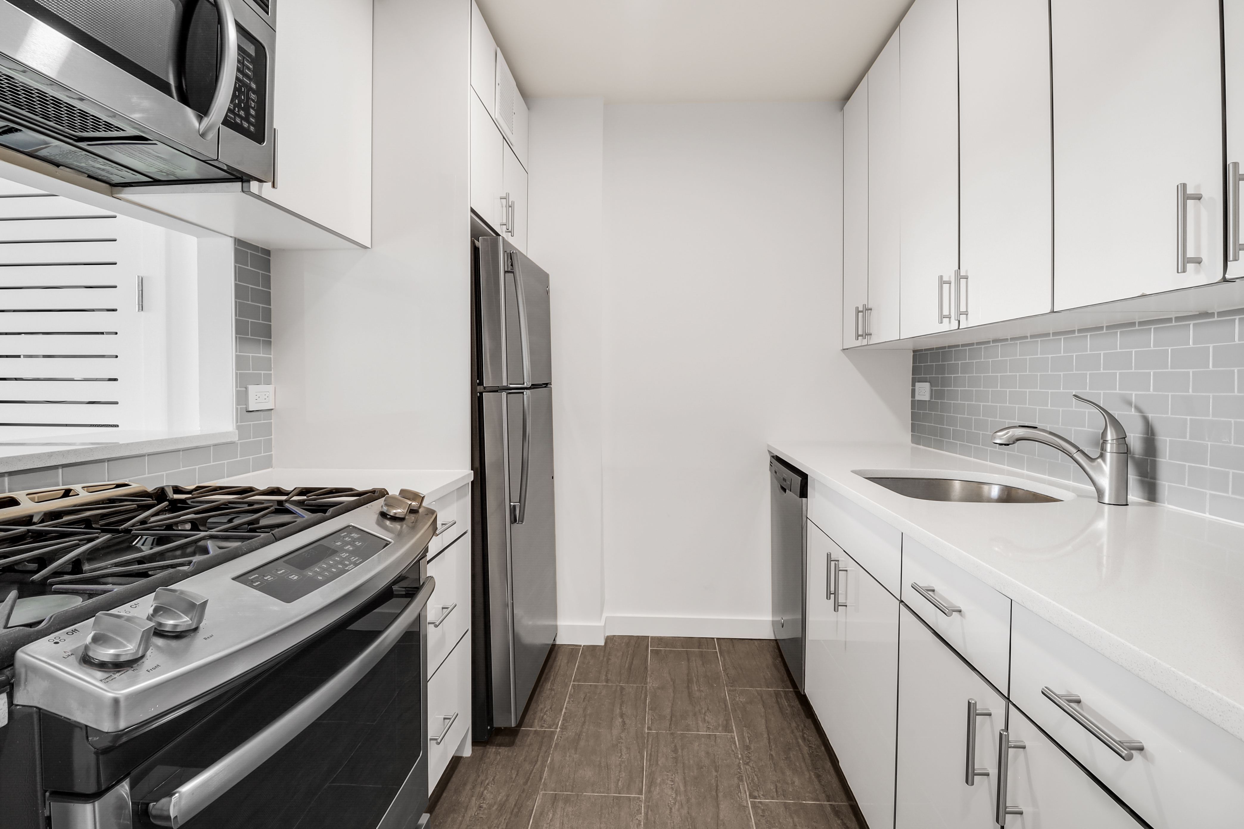 a kitchen with a stove and a sink