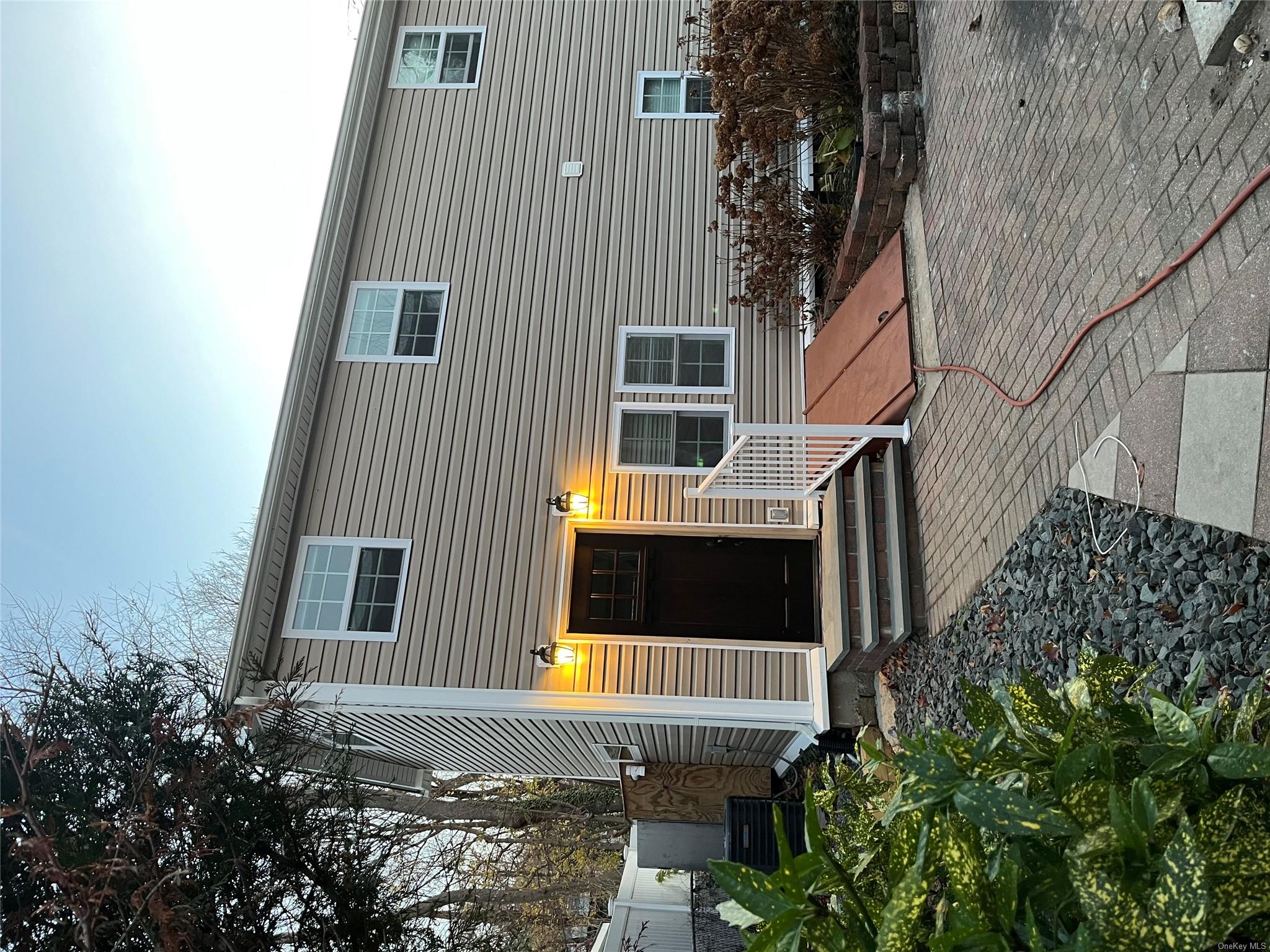 a front view of a house with stairs