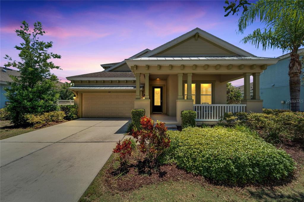 front view of a house with a garden