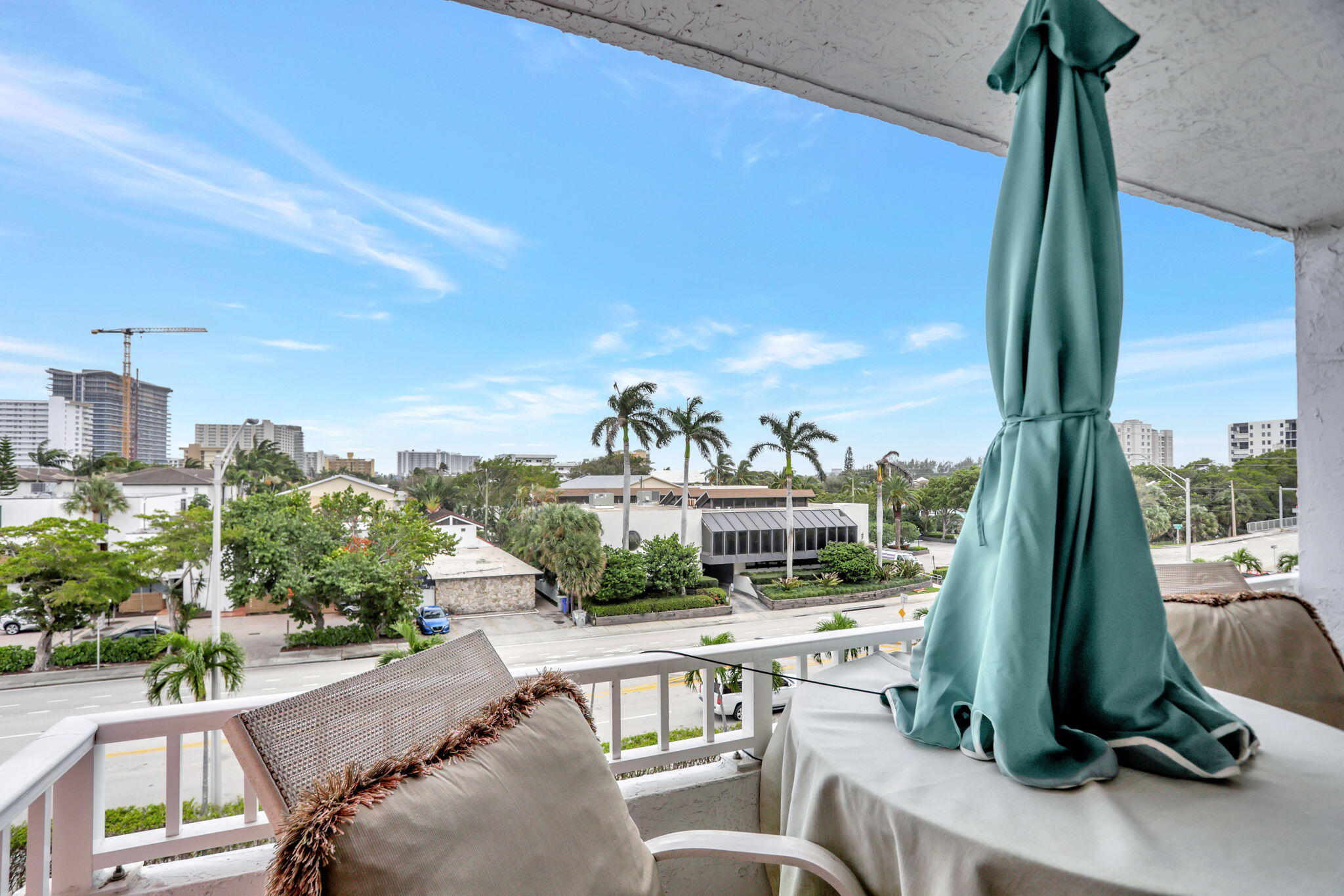 a view of balcony with furniture