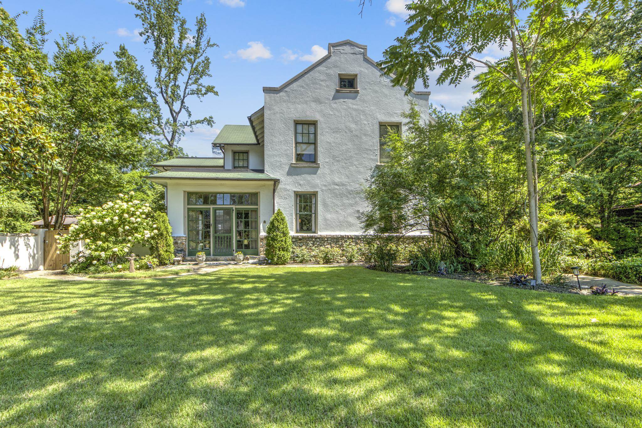 This one-of-a-kind Evergreen historic home was built in 1901 of stucco and stone, and is situated on a half acre lot, nestled in nature, and offers incomparable style and details.