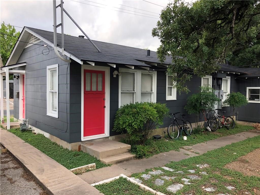 a front view of house with yard and outdoor seating