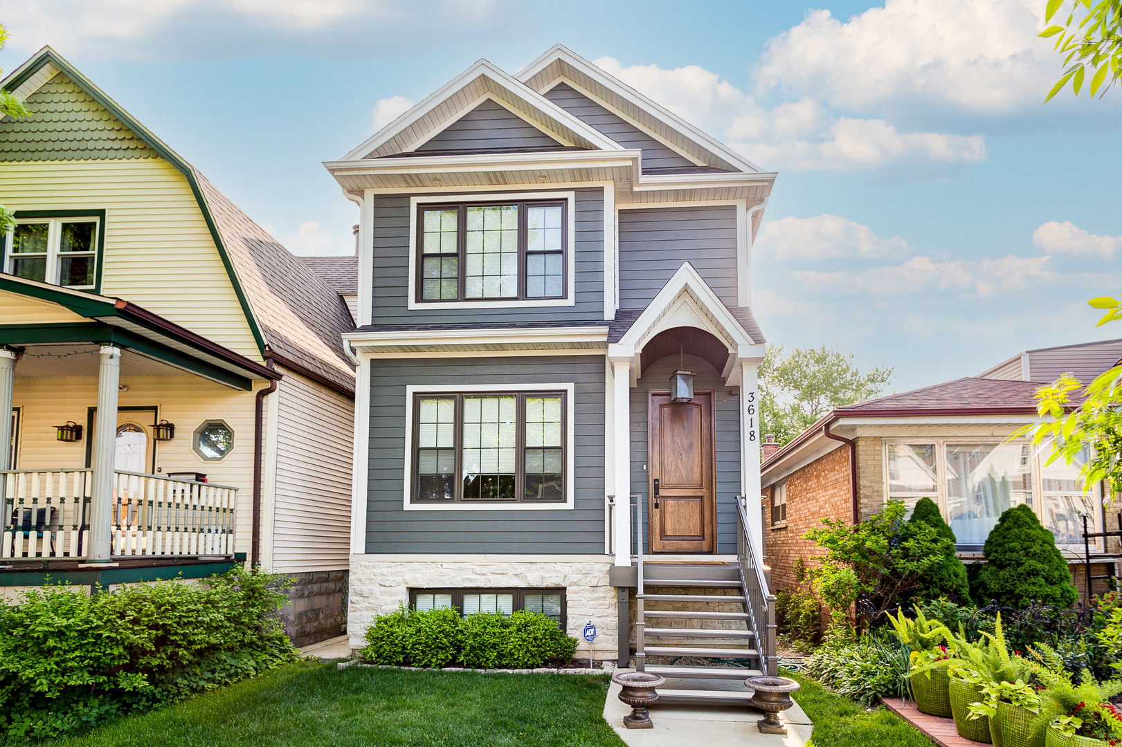 a front view of a house with a yard