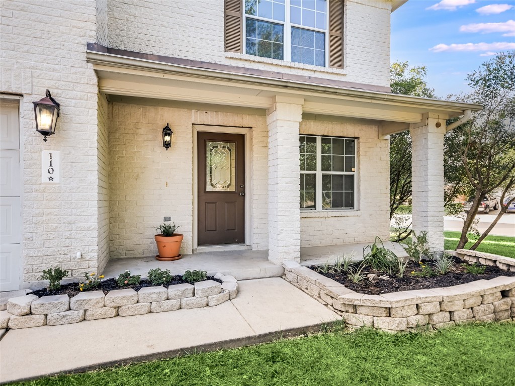 a front view of a house with yard