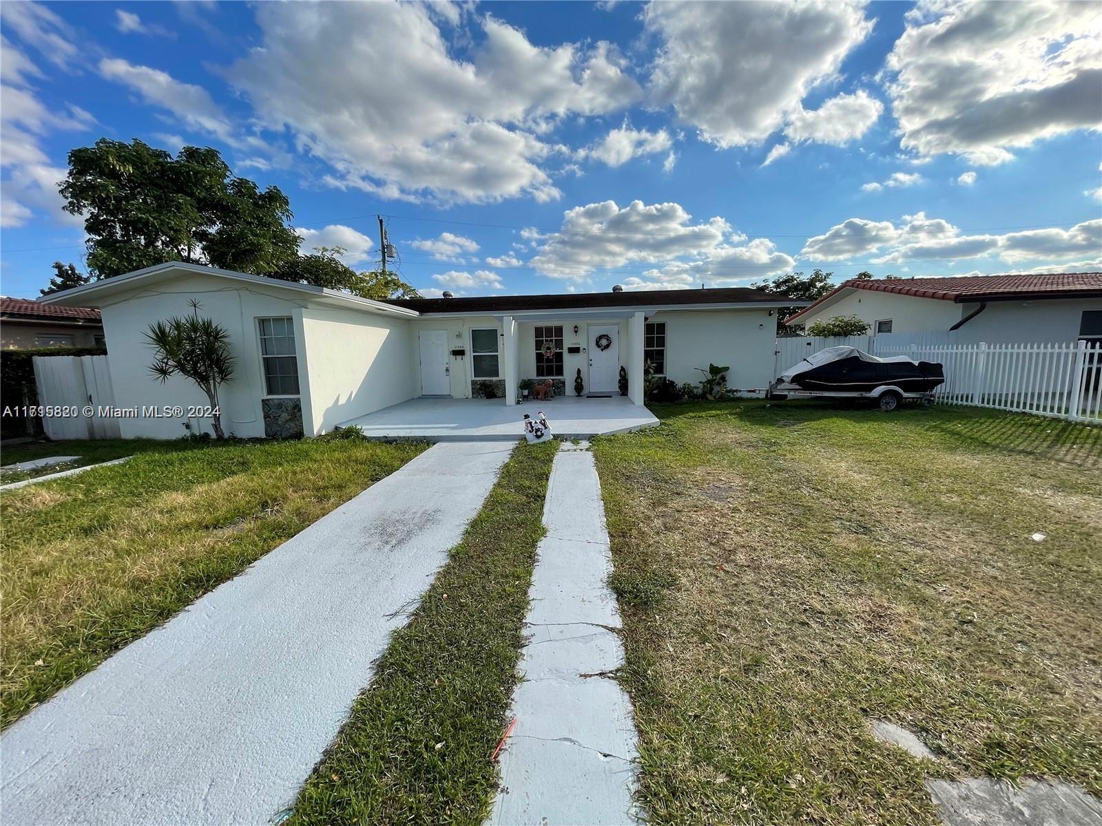 front view of a house with a yard