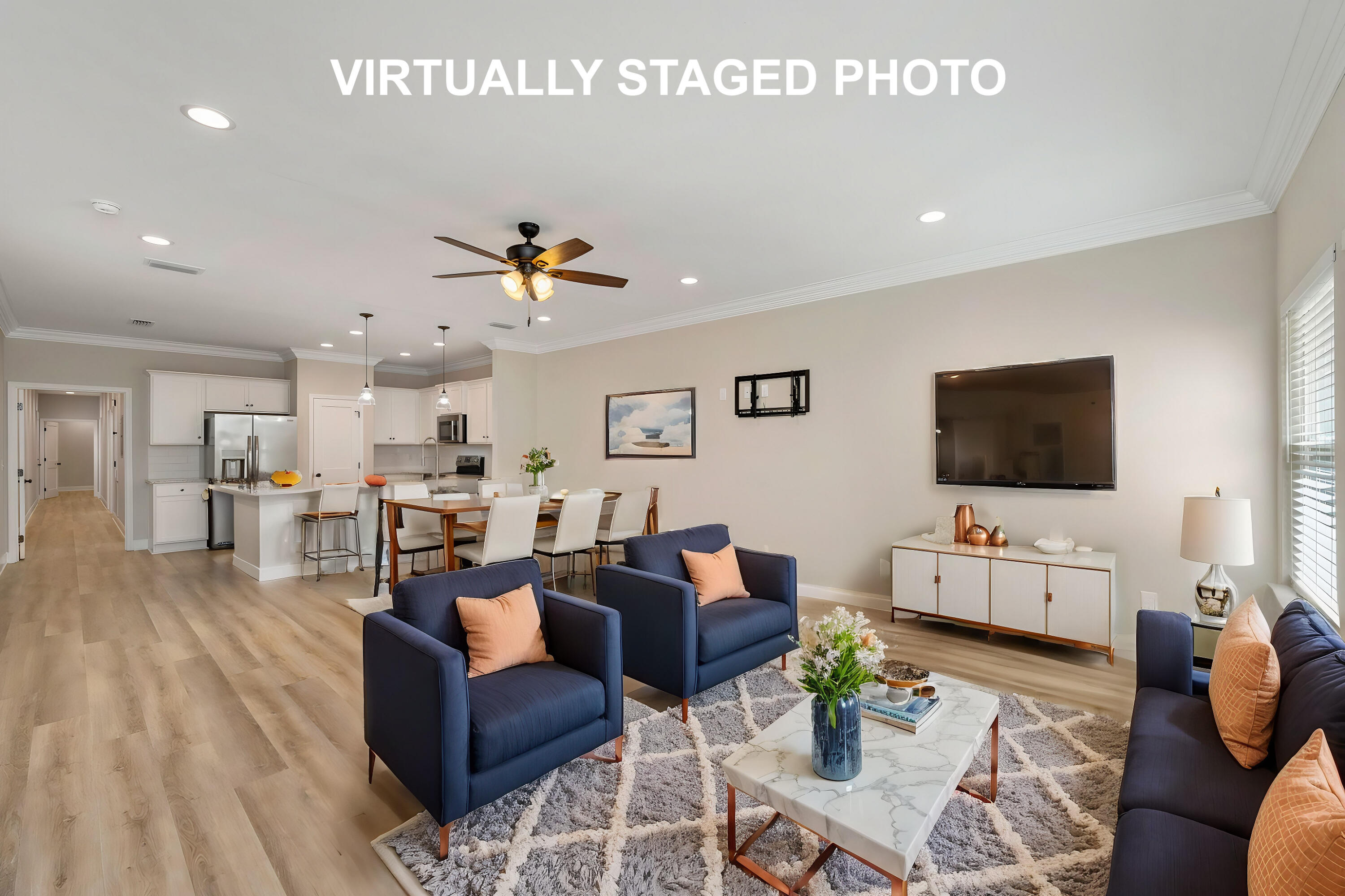 a living room with furniture and a flat screen tv