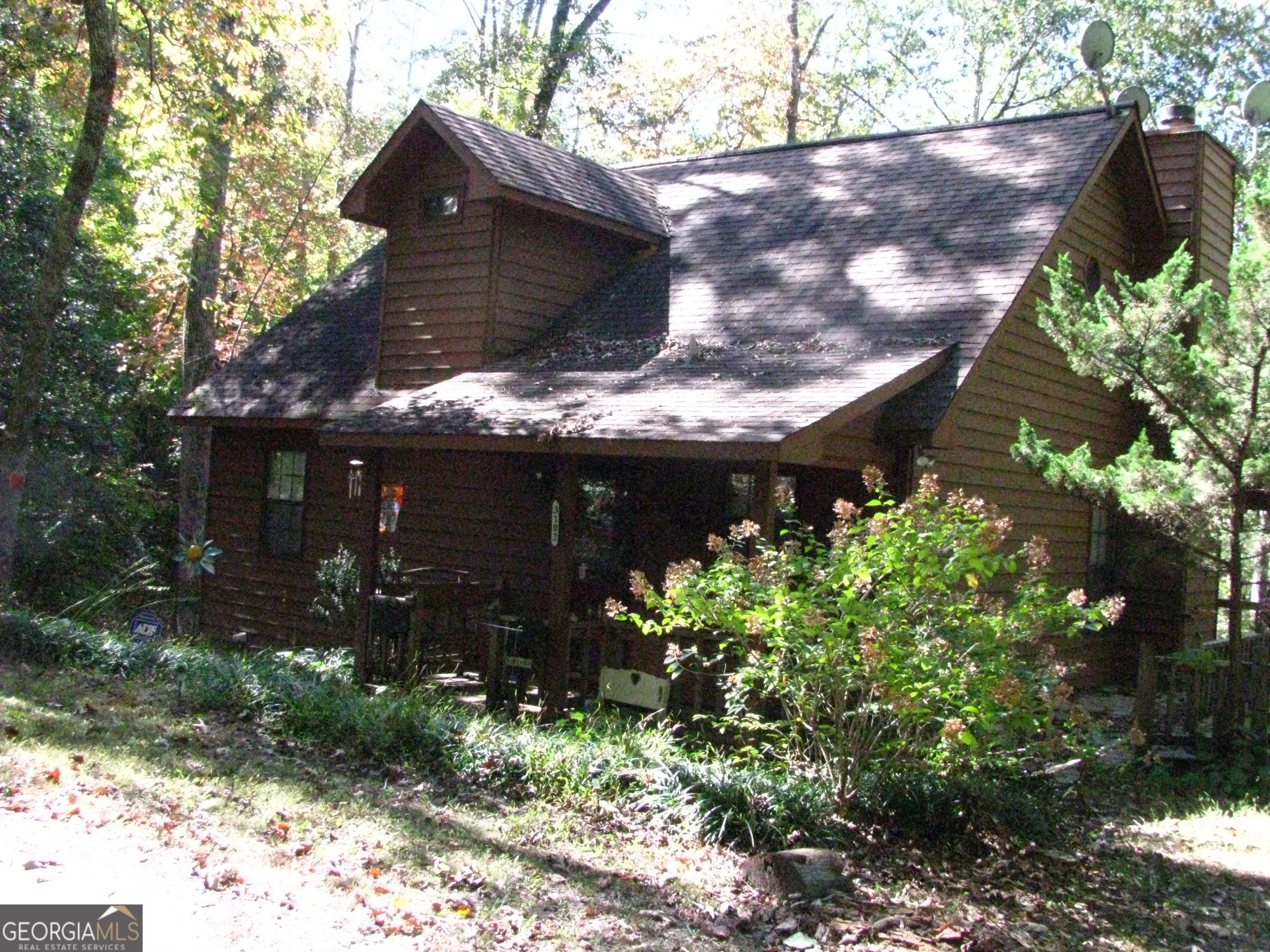 a view of a house with a tree