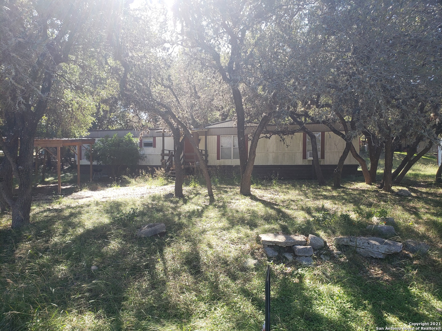 a view of backyard with large trees