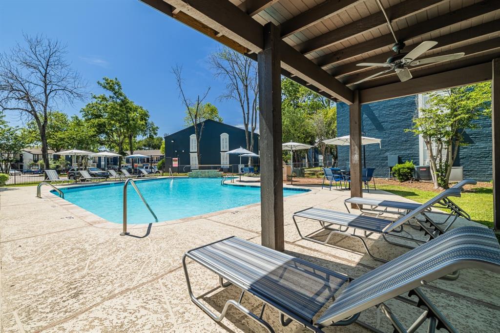 a view of a swimming pool with a patio