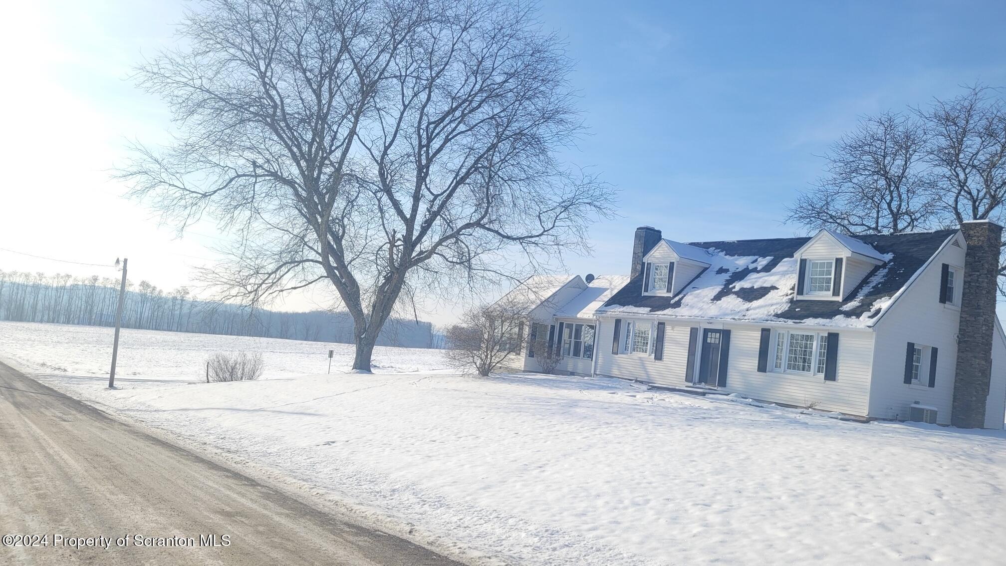 a house with trees in front of it