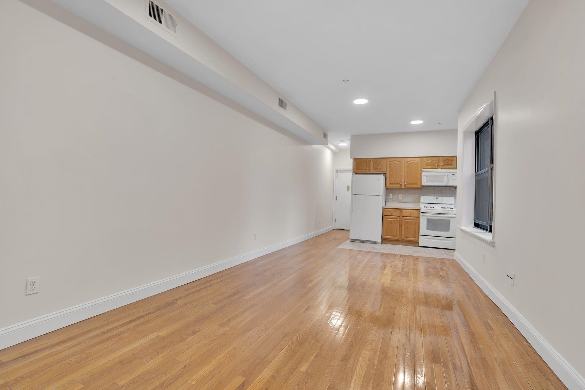 a view of kitchen with wooden floor