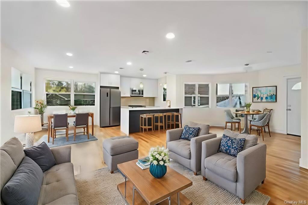 Living room with light wood-type flooring