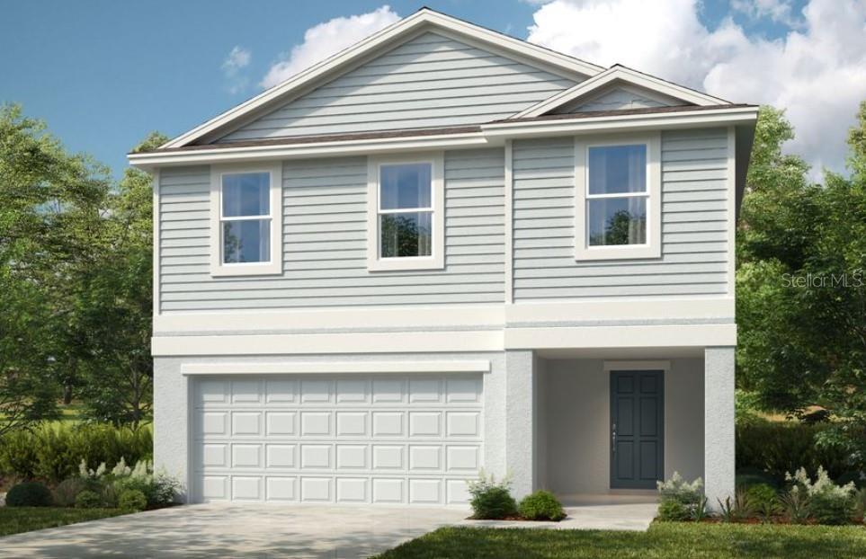 a front view of a house with garage