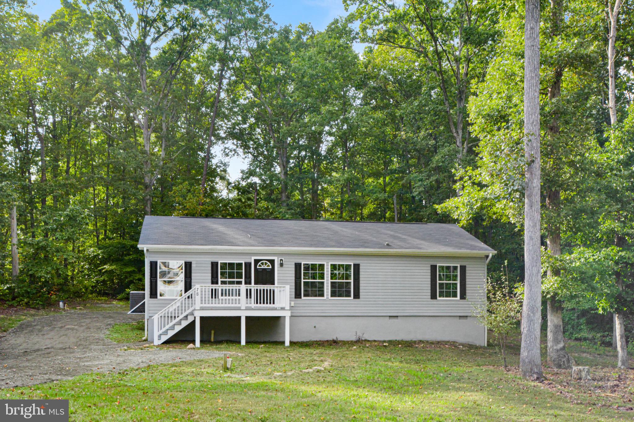 front view of a house with a yard