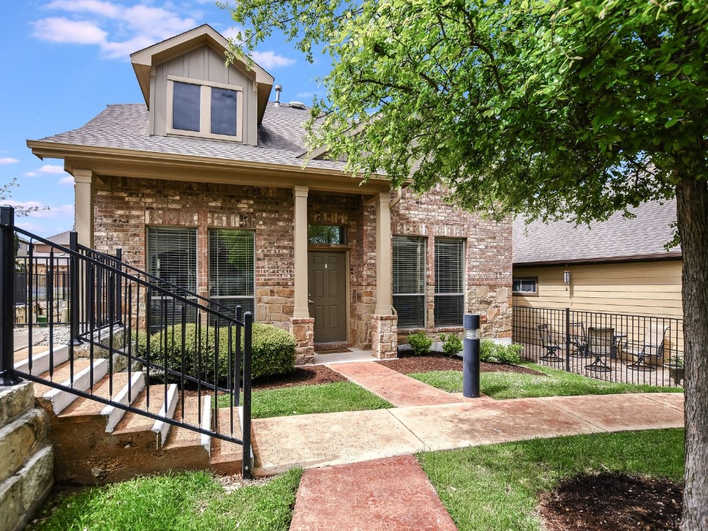 a view of a house with a yard and plants