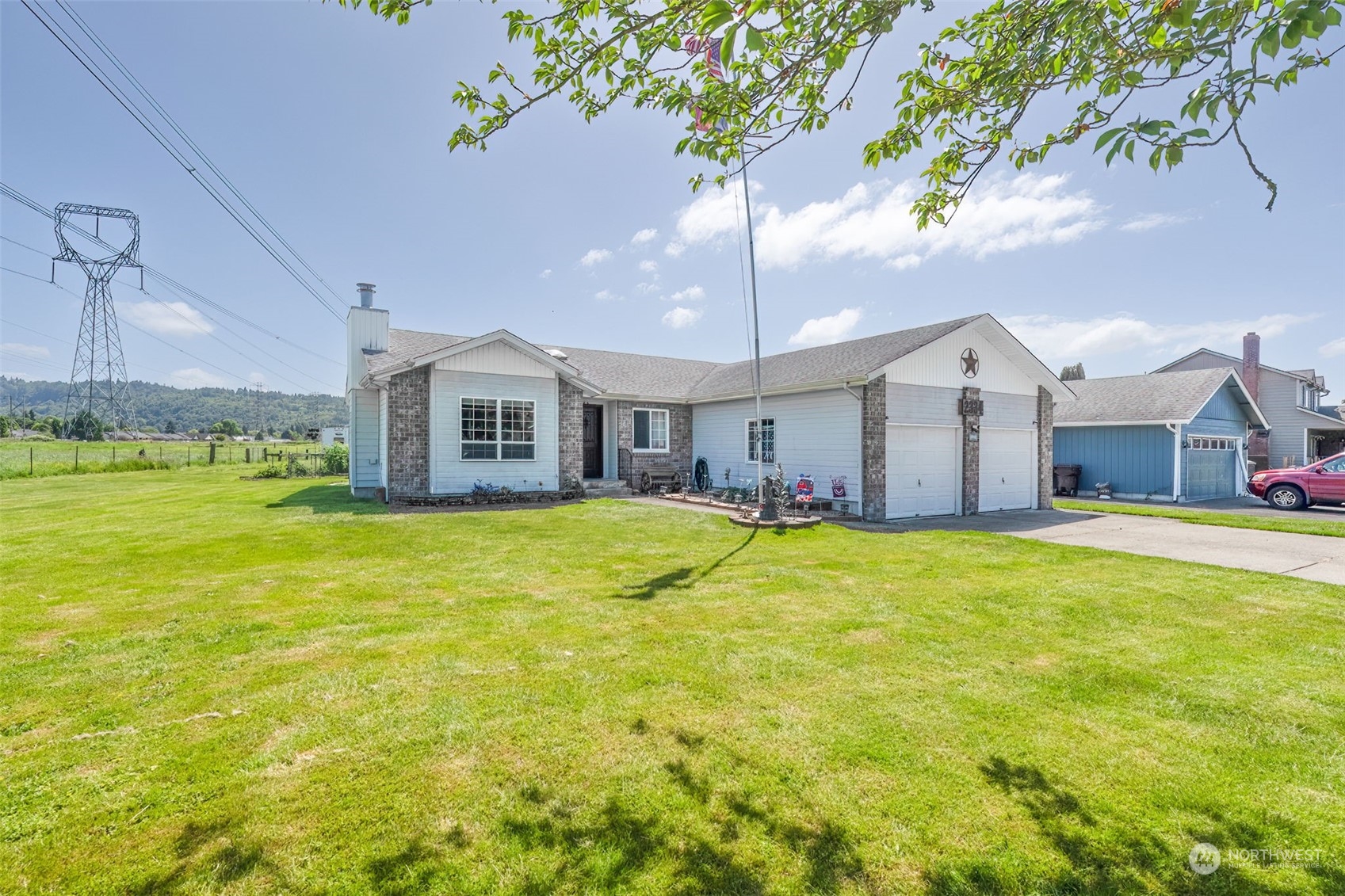 a front view of house with yard and swimming pool