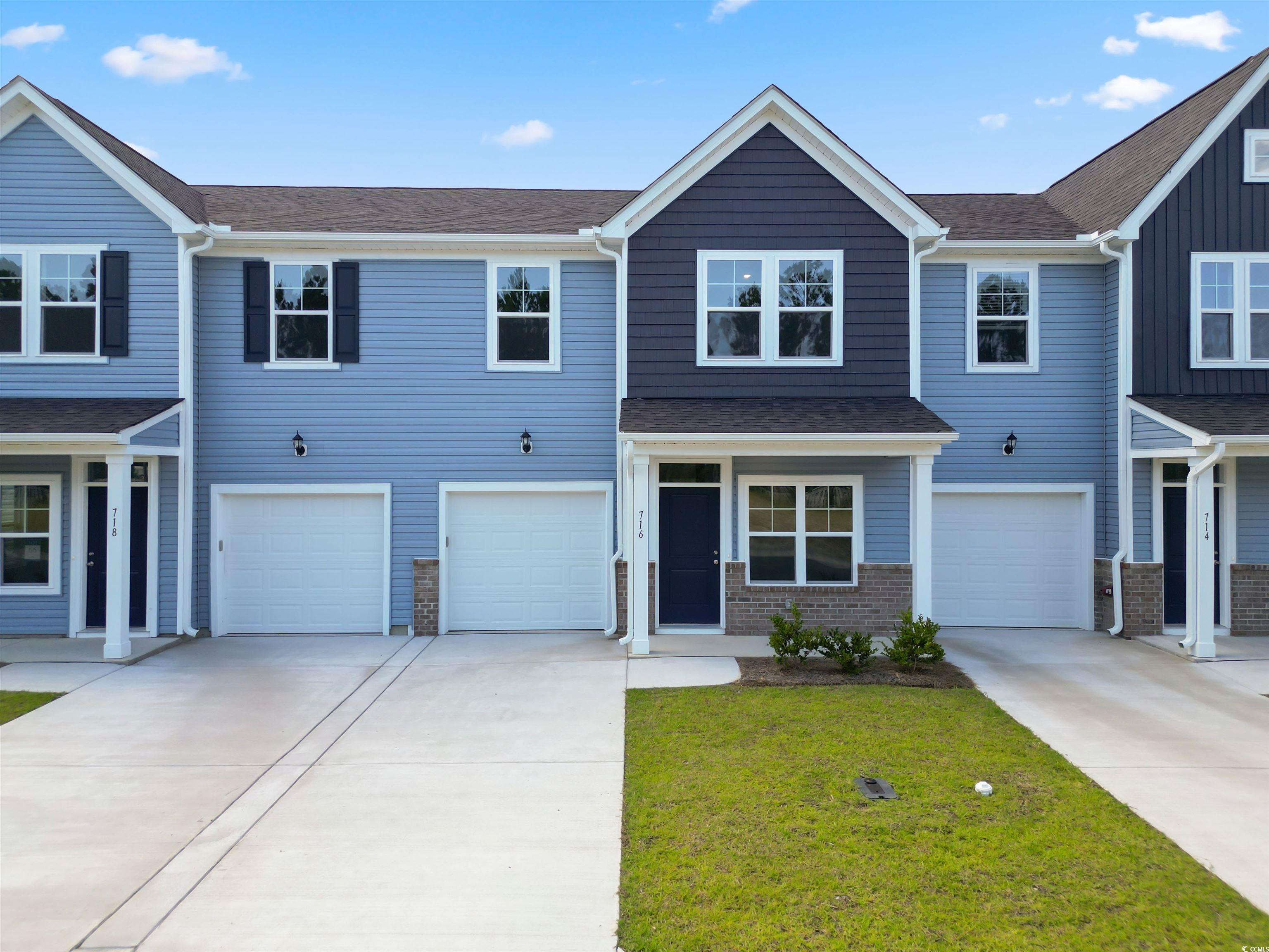 View of property featuring a garage