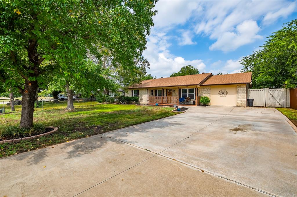 a view of house with yard and green space