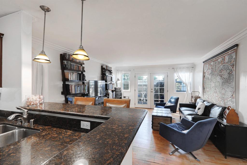 a living room with fireplace furniture and a large window